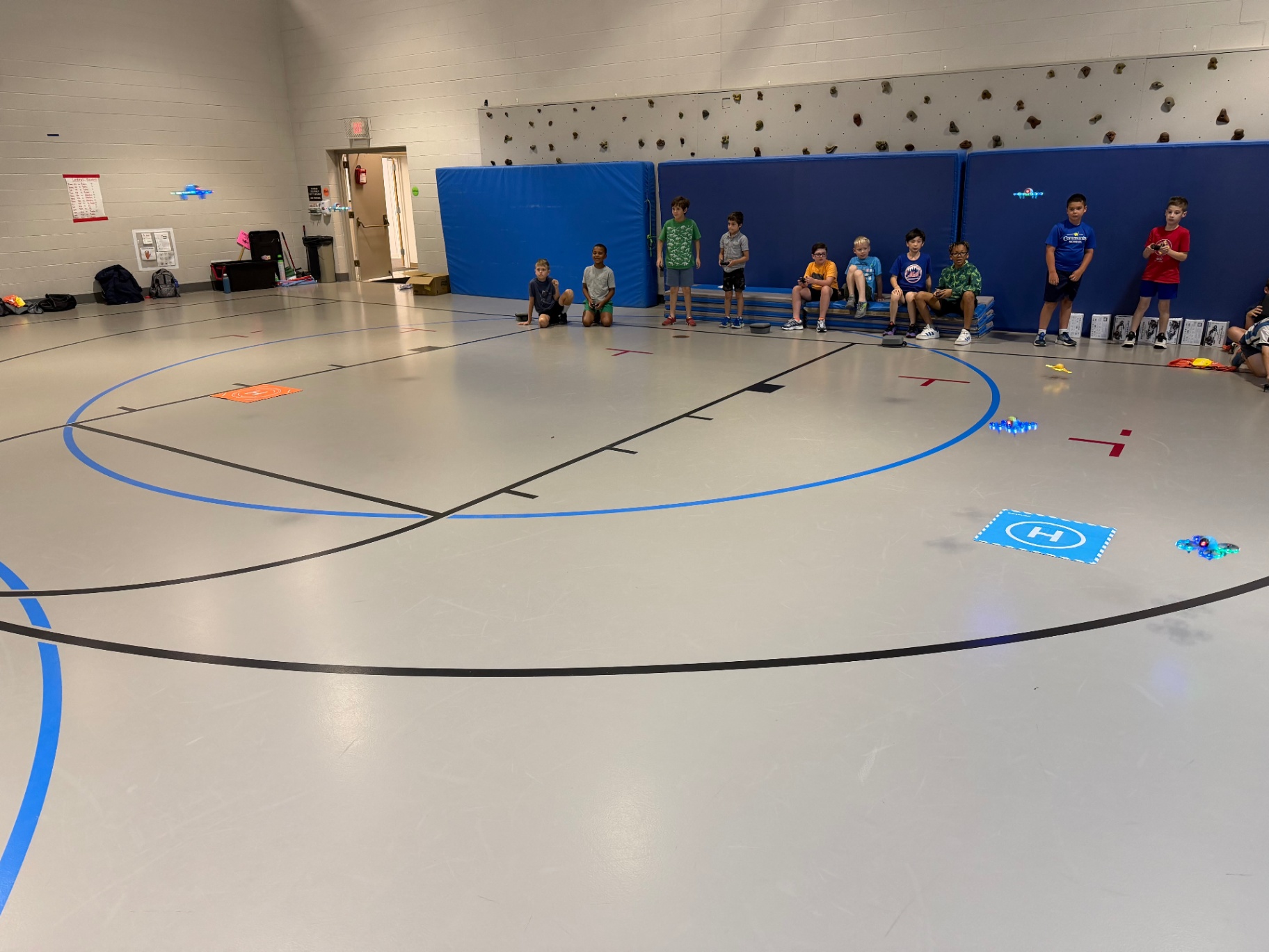 Drones in flight during a Recreation Academy drone racing session