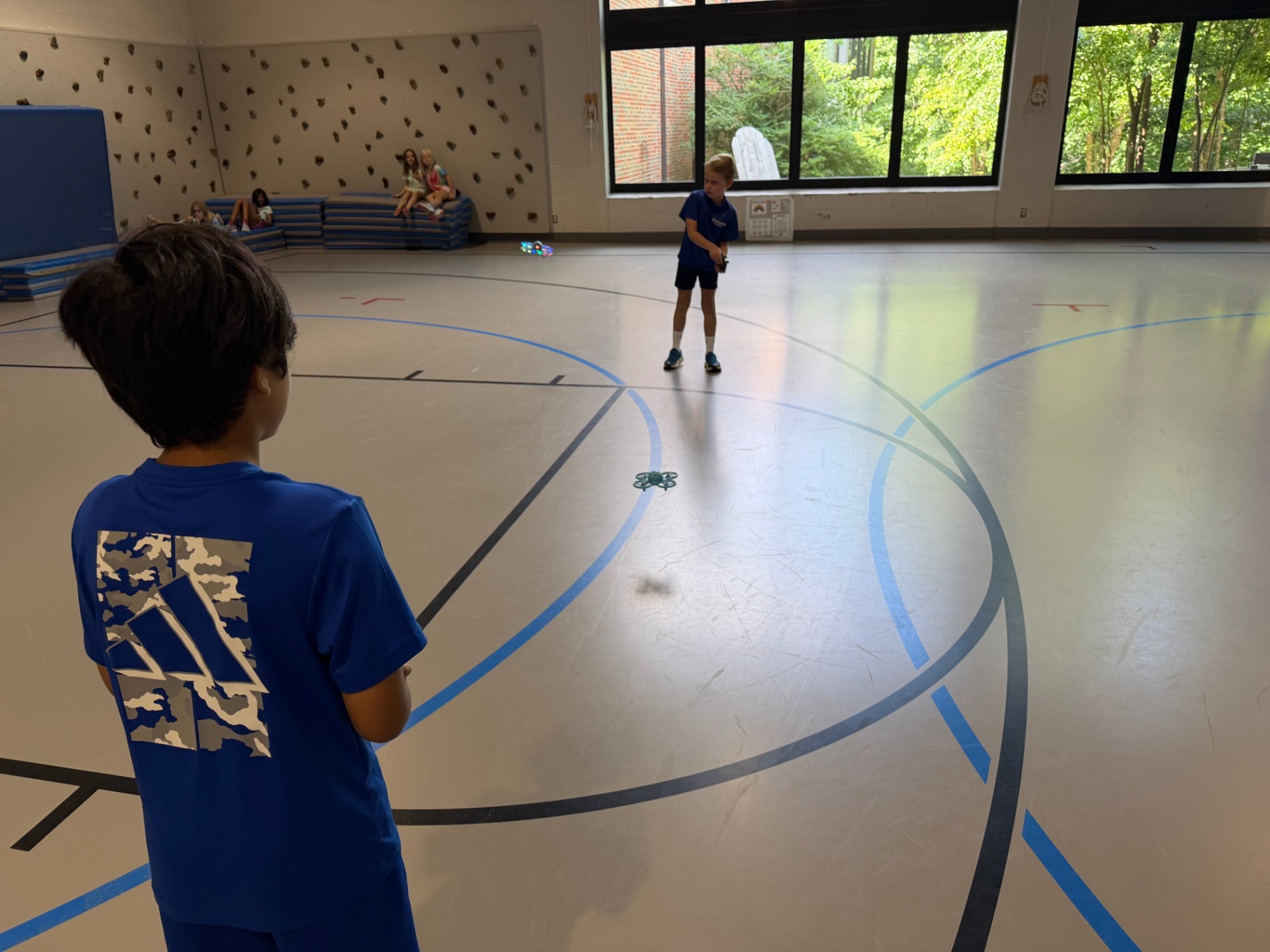 Kids piloting drones during a Recreation Academy enrichment session