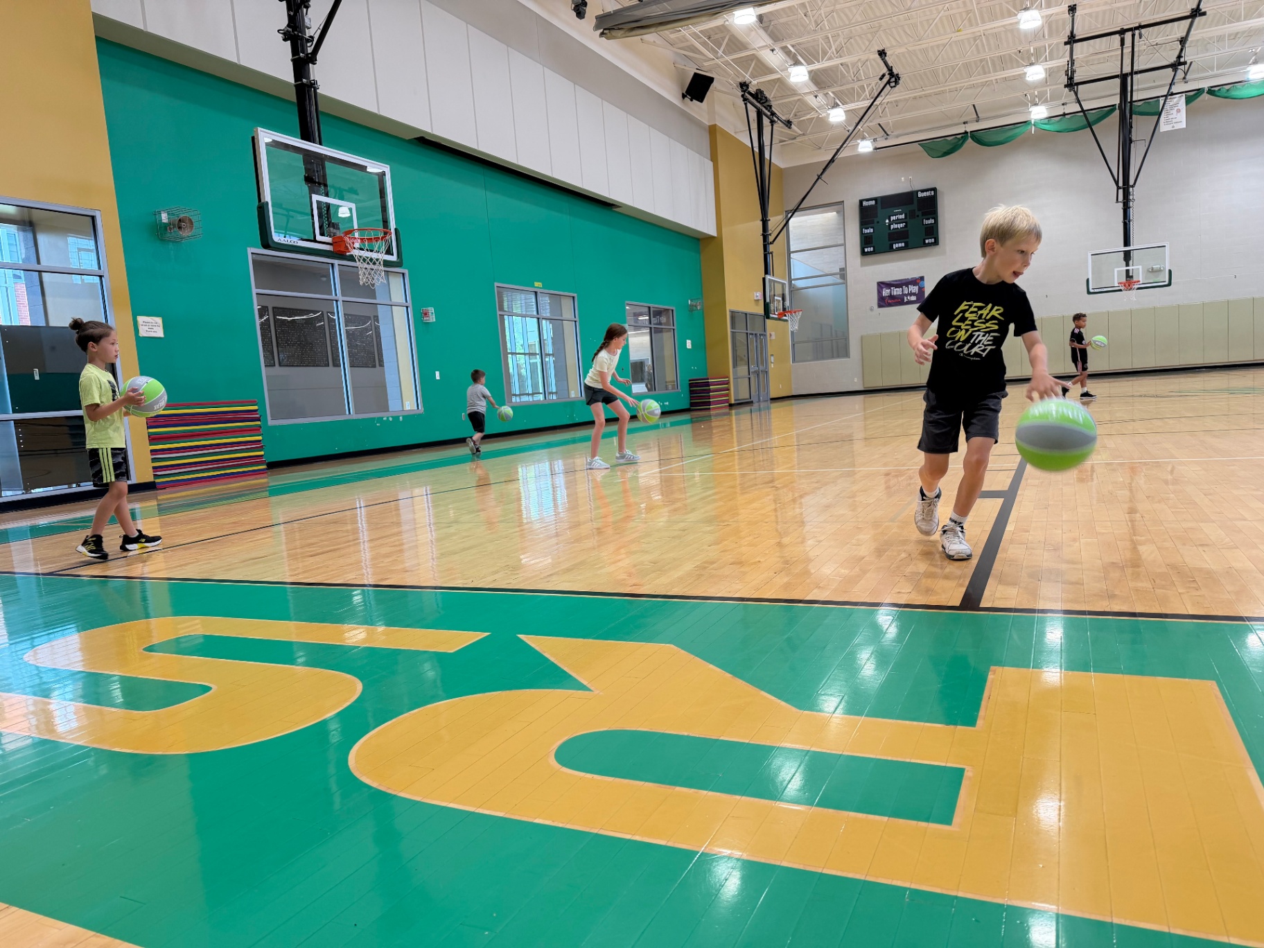 Fast-paced youth basketball action at camp