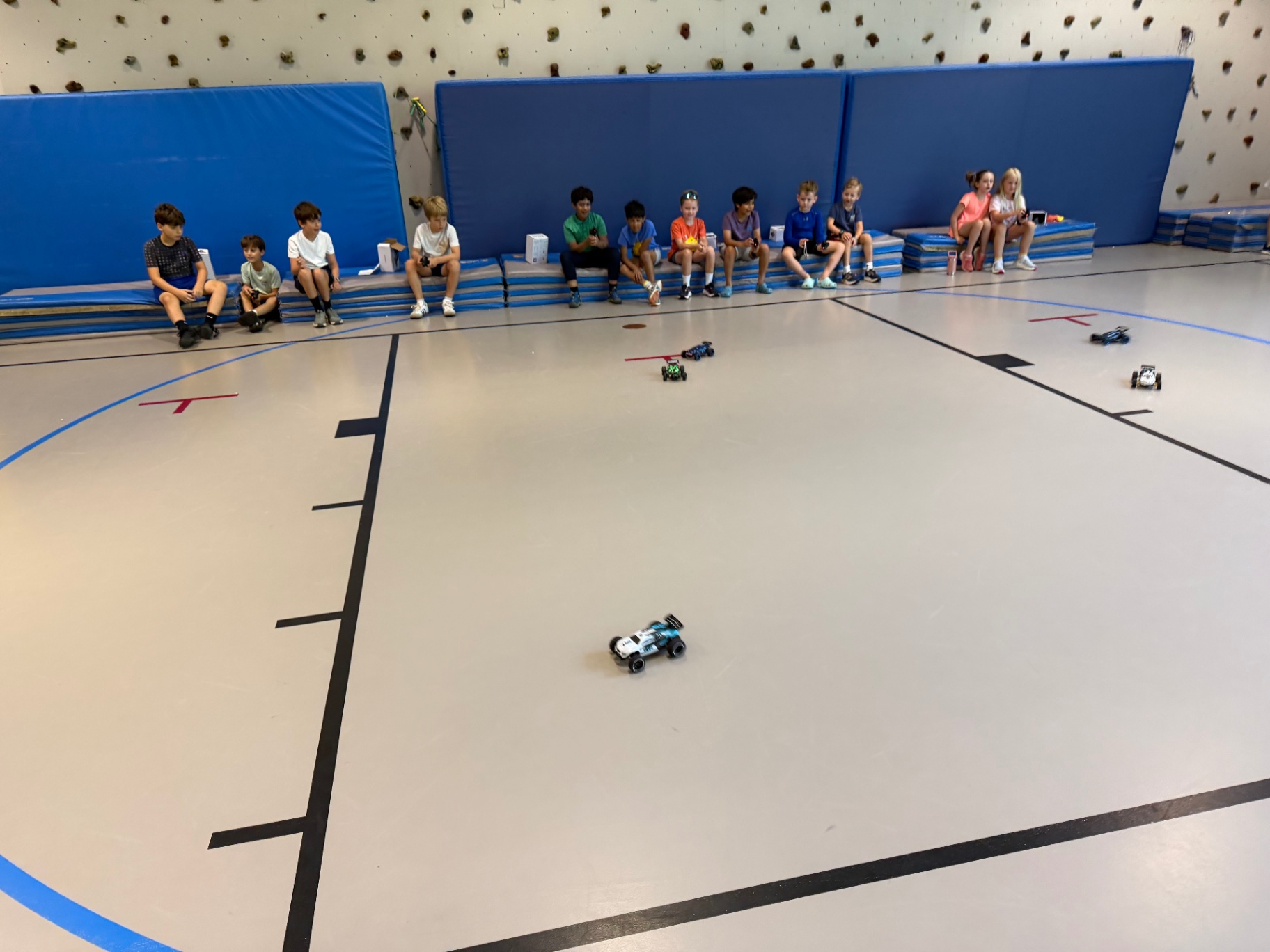 Kids racing RC cars during a Recreation Academy STEM club